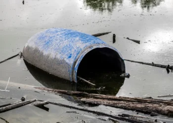 Dead man found floating in barrel.