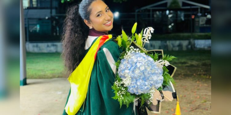 Rising Beyond Circumstances: Rita Persaud Graduates First in Family.